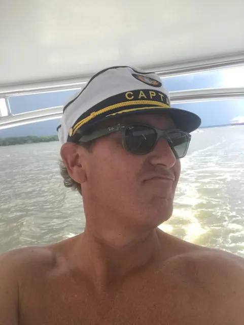 Freddy Renken on the boat in captians hat Freddy Renken on the boat